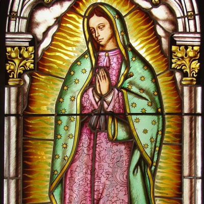 FIGURE STAINED GLASS FIGURE OF „OUR LADY OF GUADALUPE“, CHAPLE OF ST. JOHN THE BAPTIST, HREJKOVICE, DIMENSIONS 75x200 cm, ARTIST: RADEK PÁNÍK,  2011