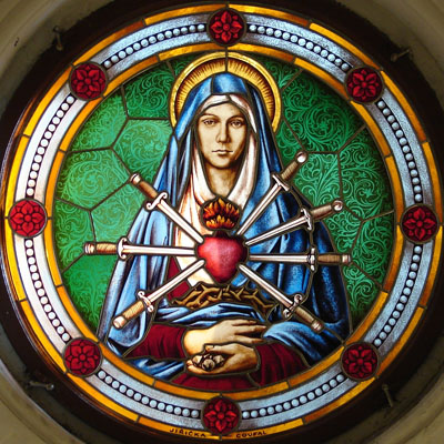 FIGURE STAINED GLASS WITH HALF-FIGURE OF OUR LADY OF SORROWS, 
            PRAGUE, Ø 130 cm, ARTIST: RADEK PÁNÍK, 2011